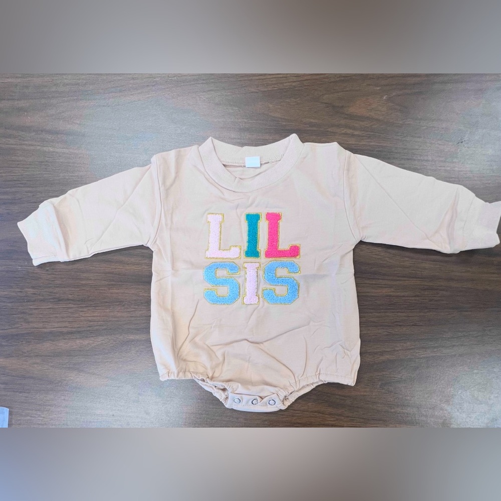 Lil Sis Baby Onesie in Cream with Colorful Letters. Size 3-6 months